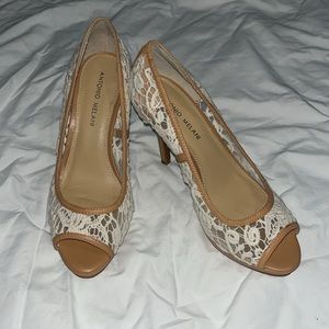 Ladies size 8, natural color,heel